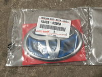 TOYOTA COROLLA E21 LIFT 23- HYBRID emblemat tył NEW ORYG.